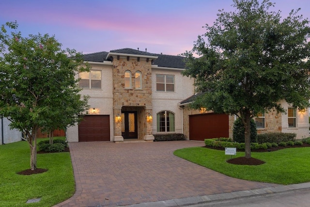 2319 Wyndam Heights Ln, Houston, TX 77077 - view of front of property with decorative driveway, a lawn, and stone siding