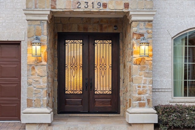 2319 Wyndam Heights Ln, Houston, TX 77077 - property entrance with french doors and stone siding