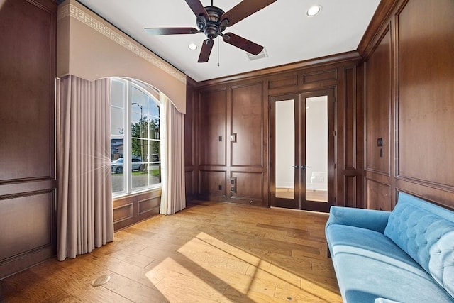 2319 Wyndam Heights Ln, Houston, TX 77077 - sitting room with a decorative wall, light wood-type flooring, ceiling fan, recessed lighting, and ornamental molding