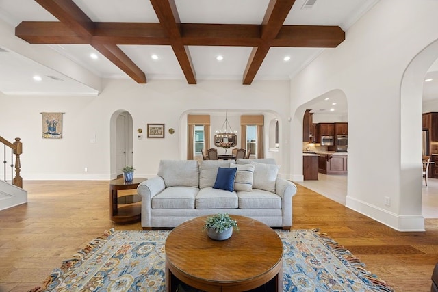 2319 Wyndam Heights Ln, Houston, TX 77077 - living area featuring arched walkways, recessed lighting, light wood finished floors, beam ceiling, and coffered ceiling