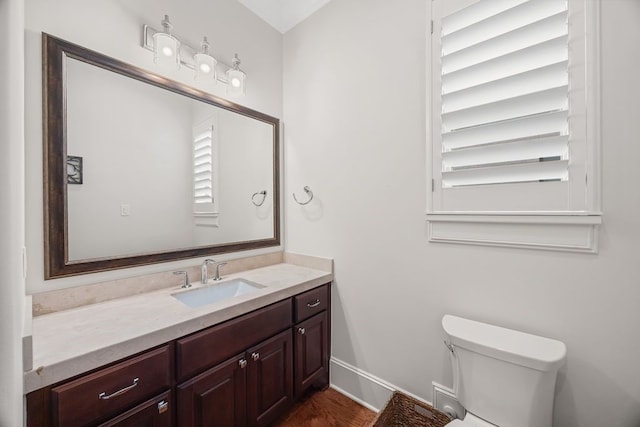 2319 Wyndam Heights Ln, Houston, TX 77077 - half bath with toilet, vanity, baseboards, and wood finished floors