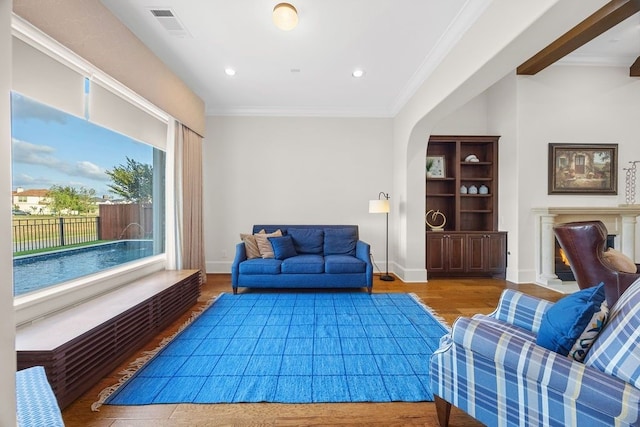 2319 Wyndam Heights Ln, Houston, TX 77077 - living room with wood finished floors, ornamental molding, recessed lighting, and baseboards