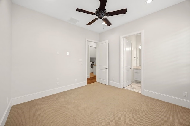 2319 Wyndam Heights Ln, Houston, TX 77077 - unfurnished bedroom with light carpet, washer / clothes dryer, baseboards, recessed lighting, and ensuite bath