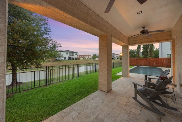 2319 Wyndam Heights Ln, Houston, TX 77077 - view of patio / terrace featuring a ceiling fan and a water view