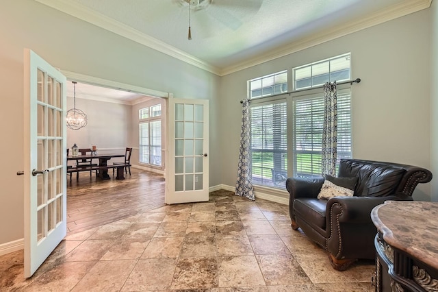 11519 Imperial Ln, Montgomery, TX 77316 - living area featuring french doors, ornamental molding, a chandelier, a ceiling fan, and baseboards