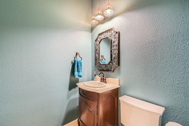 11519 Imperial Ln, Montgomery, TX 77316 - half bathroom with toilet, vanity, and a textured wall