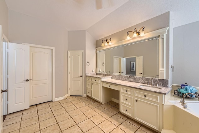 11519 Imperial Ln, Montgomery, TX 77316 - full bath featuring double vanity, tile patterned floors, lofted ceiling, and a bathtub