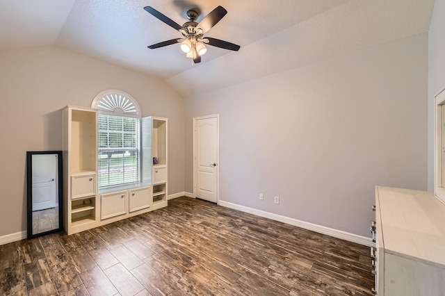 11519 Imperial Ln, Montgomery, TX 77316 - unfurnished bedroom with vaulted ceiling, dark wood-style floors, baseboards, and a ceiling fan
