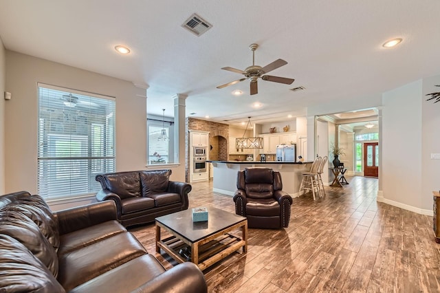 11519 Imperial Ln, Montgomery, TX 77316 - living area with decorative columns, ceiling fan, light wood finished floors, recessed lighting, and baseboards