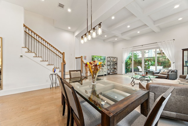 1433 Alexander St, Houston, TX 77008 - dining area with recessed lighting, beamed ceiling, stairs, light wood-type flooring, and a high ceiling