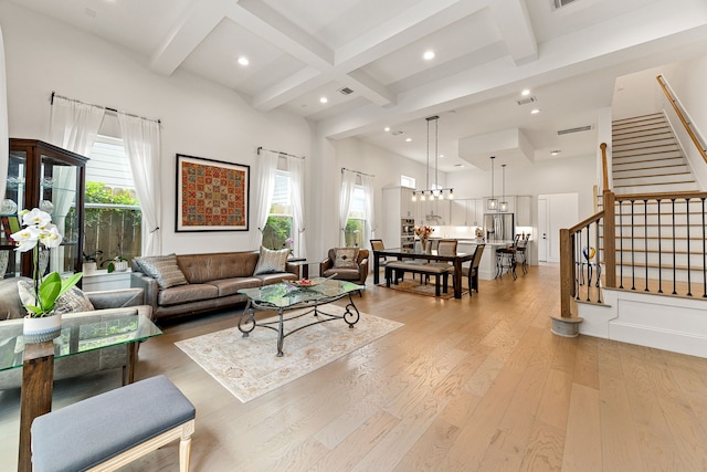 1433 Alexander St, Houston, TX 77008 - living room with healthy amount of natural light, coffered ceiling, beamed ceiling, light wood-type flooring, and stairway