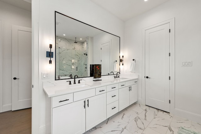 1433 Alexander St, Houston, TX 77008 - bathroom featuring a marble finish shower, double vanity, marble look tile flooring, recessed lighting, and baseboards