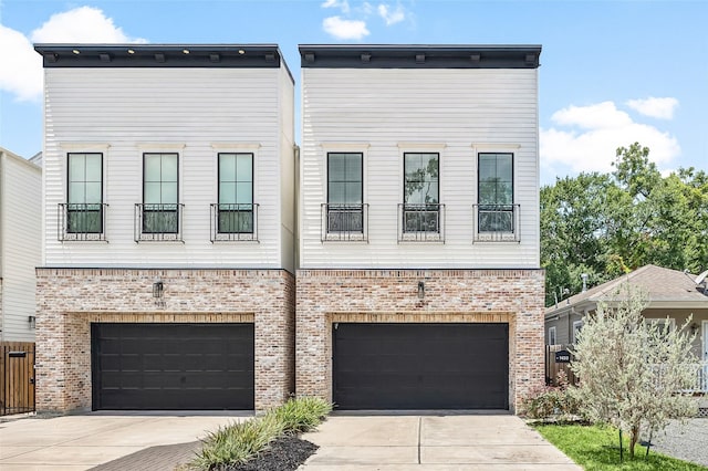 1433 Alexander St, Houston, TX 77008 - townhome / multi-family property with a garage, concrete driveway, and brick siding