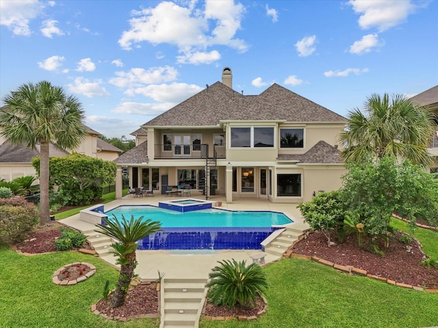 2905 Sea Channel Dr, Seabrook, TX 77586 - view of pool featuring a lawn, a patio area, and a pool with connected hot tub