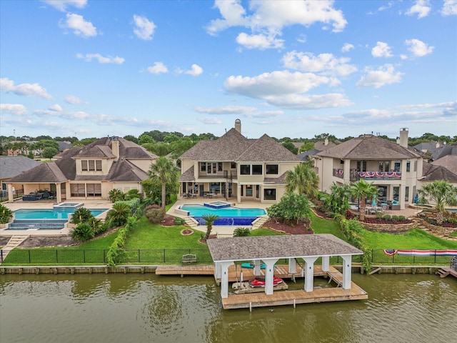 2905 Sea Channel Dr, Seabrook, TX 77586 - rear view of house with a balcony, boat lift, a water view, and a patio area