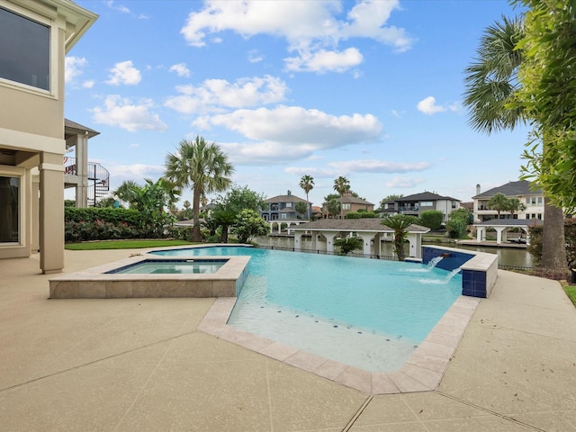 2905 Sea Channel Dr, Seabrook, TX 77586 - view of pool featuring a pool with connected hot tub, a patio, and a residential view