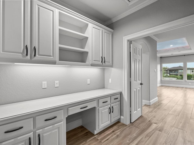 2905 Sea Channel Dr, Seabrook, TX 77586 - unfurnished office featuring ornamental molding, built in study area, light wood finished floors, and baseboards