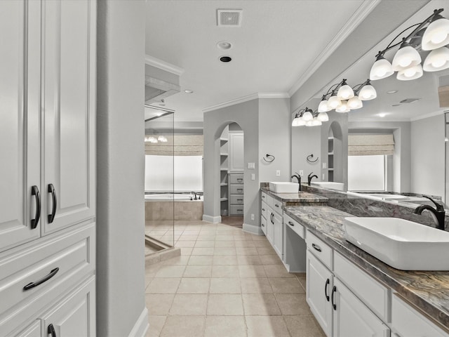 2905 Sea Channel Dr, Seabrook, TX 77586 - bathroom with crown molding, double vanity, a stall shower, tile patterned floors, and baseboards