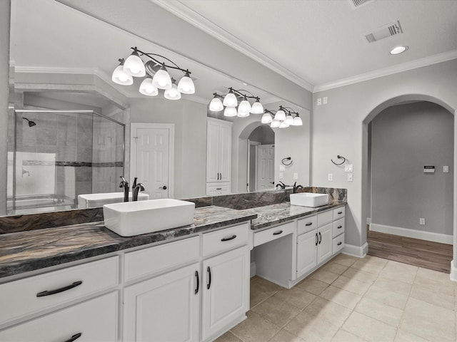 2905 Sea Channel Dr, Seabrook, TX 77586 - full bathroom with vanity, ornamental molding, a shower stall, tile patterned flooring, and baseboards