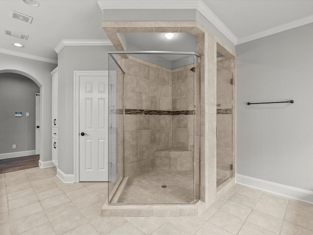 2905 Sea Channel Dr, Seabrook, TX 77586 - bathroom featuring crown molding, a shower stall, baseboards, and tile patterned floors