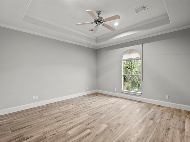 2905 Sea Channel Dr, Seabrook, TX 77586 - spare room with a raised ceiling, light wood-style floors, ornamental molding, a ceiling fan, and baseboards