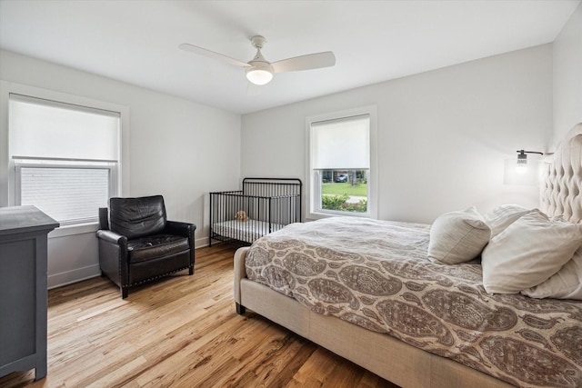 2218 Gardenia Dr, Houston, TX 77018 - bedroom with light wood finished floors, ceiling fan, and baseboards