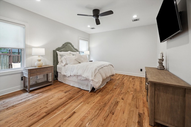 2218 Gardenia Dr, Houston, TX 77018 - bedroom with light wood finished floors, baseboards, recessed lighting, and ceiling fan