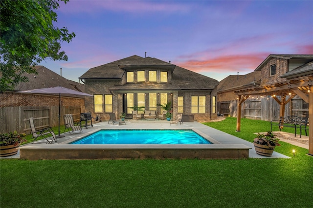 399 Black Walnut Dr, Conroe, TX 77304 - back of house at dusk with brick siding, a pergola, and a patio