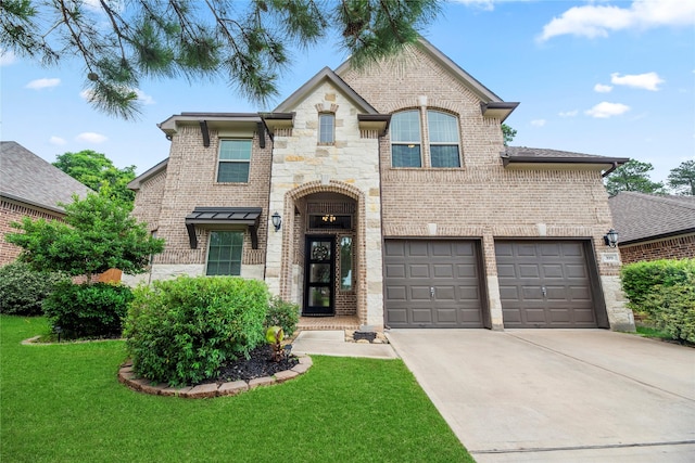 399 Black Walnut Dr, Conroe, TX 77304 - french country home with brick siding, concrete driveway, a front yard, and a garage
