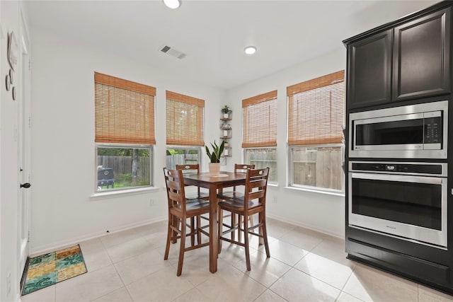 399 Black Walnut Dr, Conroe, TX 77304 - dining space with baseboards, recessed lighting, and light tile patterned floors