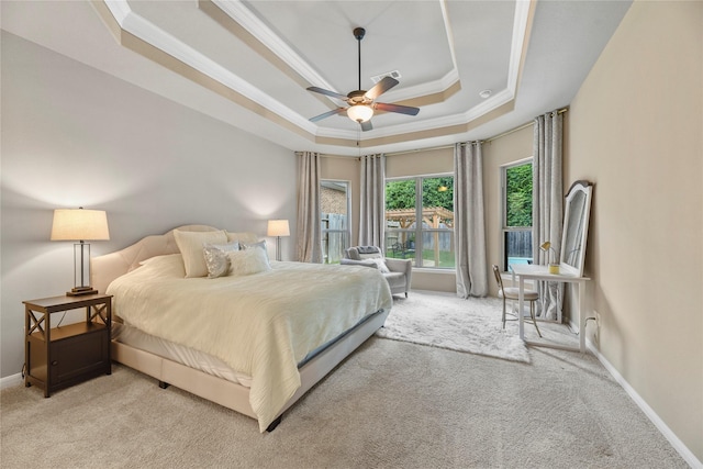 399 Black Walnut Dr, Conroe, TX 77304 - bedroom with a raised ceiling, crown molding, light carpet, baseboards, and ceiling fan
