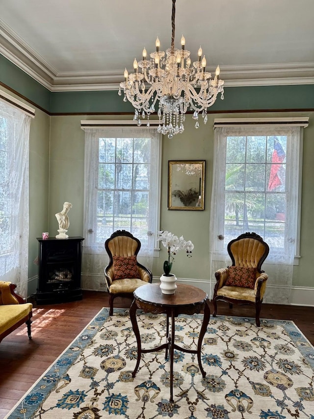 1309 Broadway St, Galveston, TX 77550 - living area featuring plenty of natural light, ornamental molding, a chandelier, and baseboards