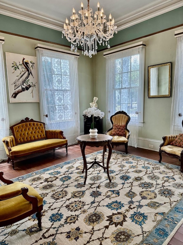 1309 Broadway St, Galveston, TX 77550 - sitting room featuring crown molding, wood finished floors, a chandelier, and baseboards