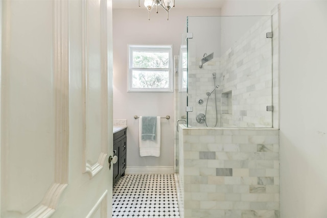 1309 Broadway St, Galveston, TX 77550 - bathroom with vanity, a stall shower, baseboards, and tile patterned floors