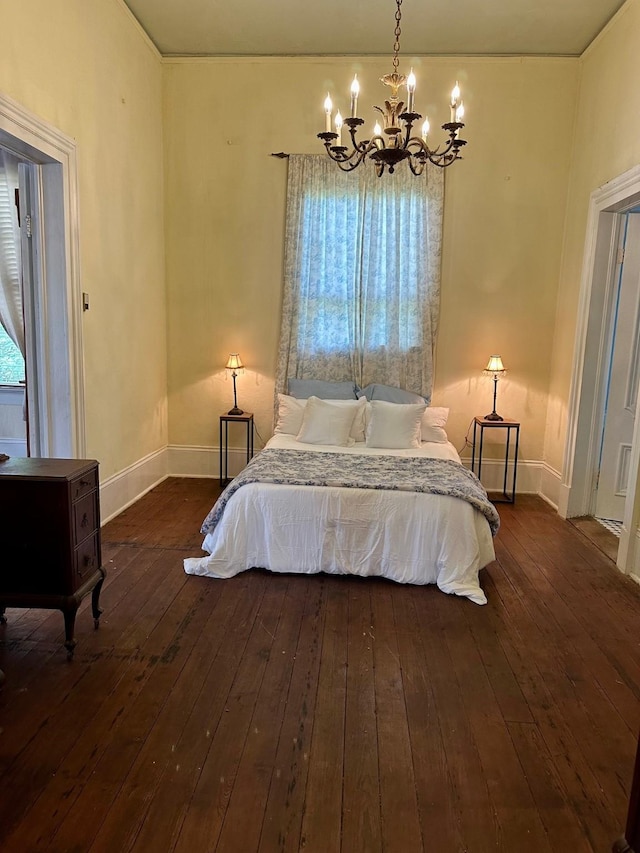 1309 Broadway St, Galveston, TX 77550 - bedroom featuring a chandelier, baseboards, and dark wood-style flooring