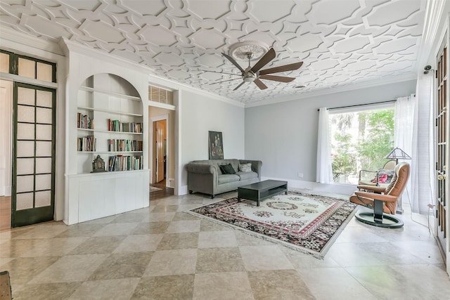 1309 Broadway St, Galveston, TX 77550 - living room with ornamental molding, a ceiling fan, and built in shelves