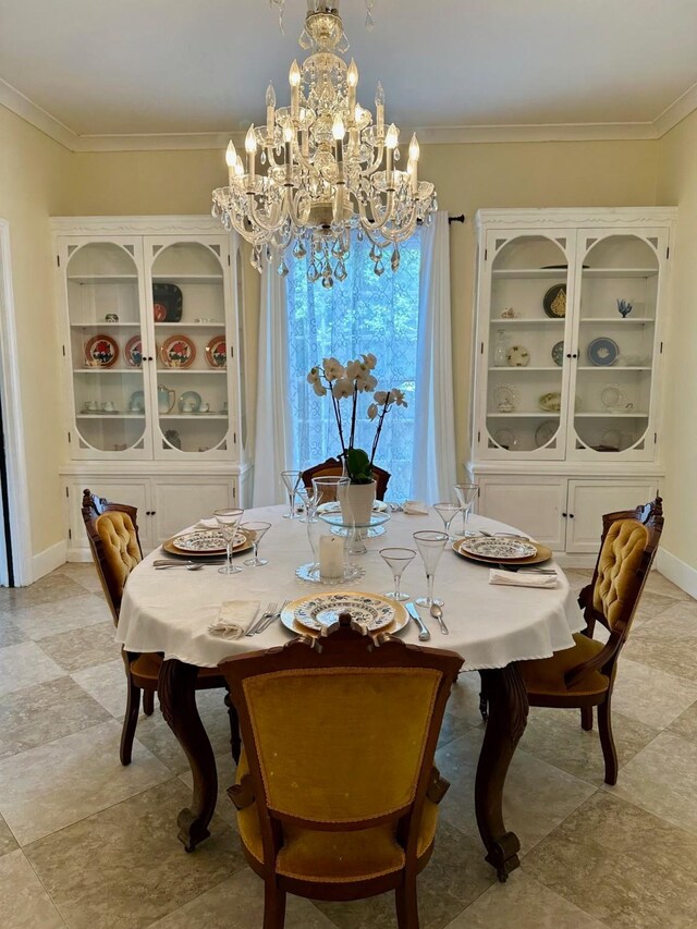 1309 Broadway St, Galveston, TX 77550 - dining room with a chandelier, crown molding, and baseboards