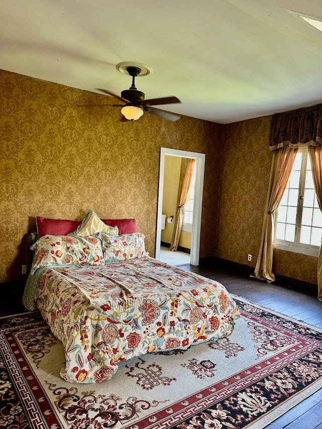 1309 Broadway St, Galveston, TX 77550 - bedroom with wallpapered walls, hardwood / wood-style flooring, and a ceiling fan