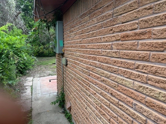 6619 Carver Ave, Hitchcock, TX 77563 - view of side of home featuring brick siding