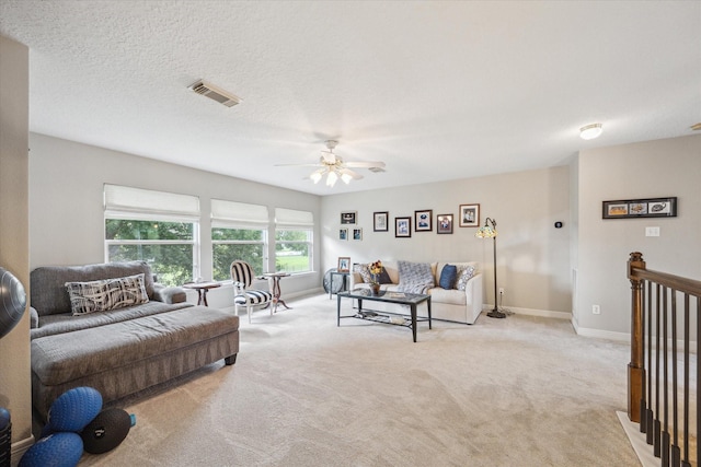 19 Remington Park, Katy, TX 77493 - living area with light colored carpet, a ceiling fan, and baseboards