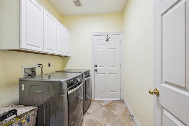 19 Remington Park, Katy, TX 77493 - laundry area with cabinet space, separate washer and dryer, light tile patterned flooring, and baseboards