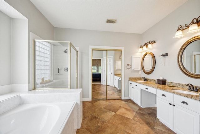 19 Remington Park, Katy, TX 77493 - full bathroom with double vanity, a stall shower, and a garden tub