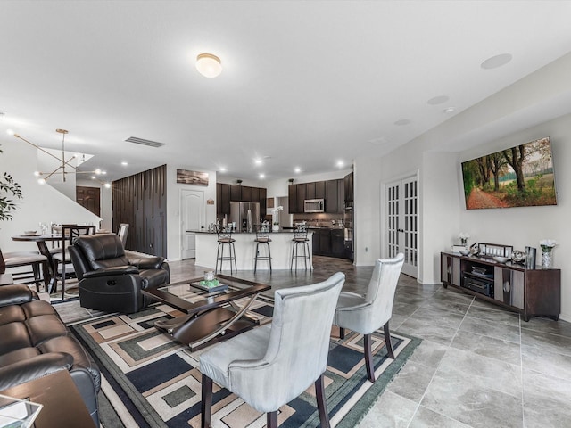 14306 Cedar Pine Ct, Houston, TX 77068 - living room featuring a chandelier and recessed lighting
