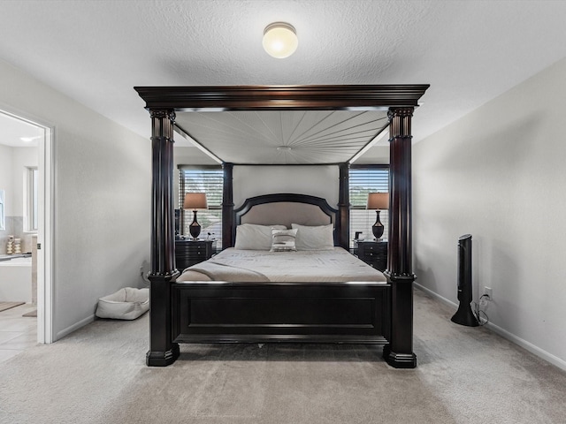 14306 Cedar Pine Ct, Houston, TX 77068 - carpeted bedroom featuring baseboards and connected bathroom