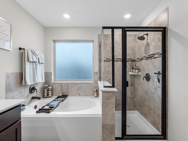 14306 Cedar Pine Ct, Houston, TX 77068 - full bath with a garden tub, a stall shower, and vanity
