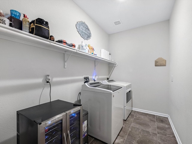 14306 Cedar Pine Ct, Houston, TX 77068 - laundry area featuring washing machine and clothes dryer, baseboards, and beverage cooler
