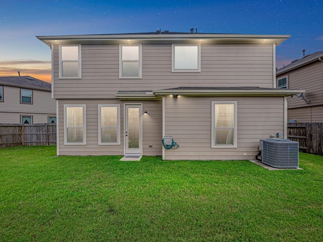 14306 Cedar Pine Ct, Houston, TX 77068 - back of house at dusk featuring central air condition unit