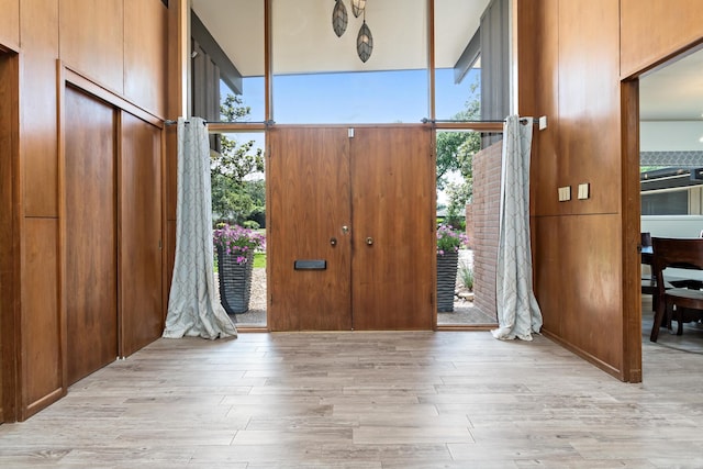 1240 Oakcrest Cir, Beaumont, TX 77706 - foyer with wood finished floors and a wall of windows