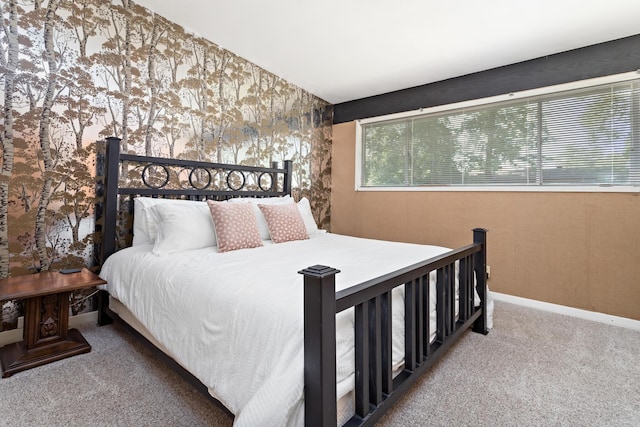 1240 Oakcrest Cir, Beaumont, TX 77706 - bedroom featuring carpet flooring, wallpapered walls, and baseboards