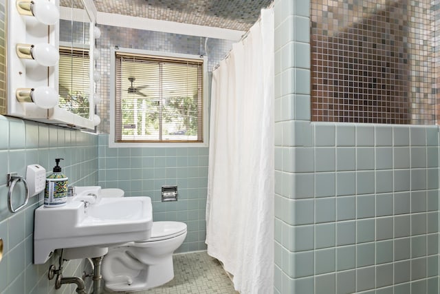 1240 Oakcrest Cir, Beaumont, TX 77706 - bathroom with tile walls, toilet, curtained shower, and tile patterned floors